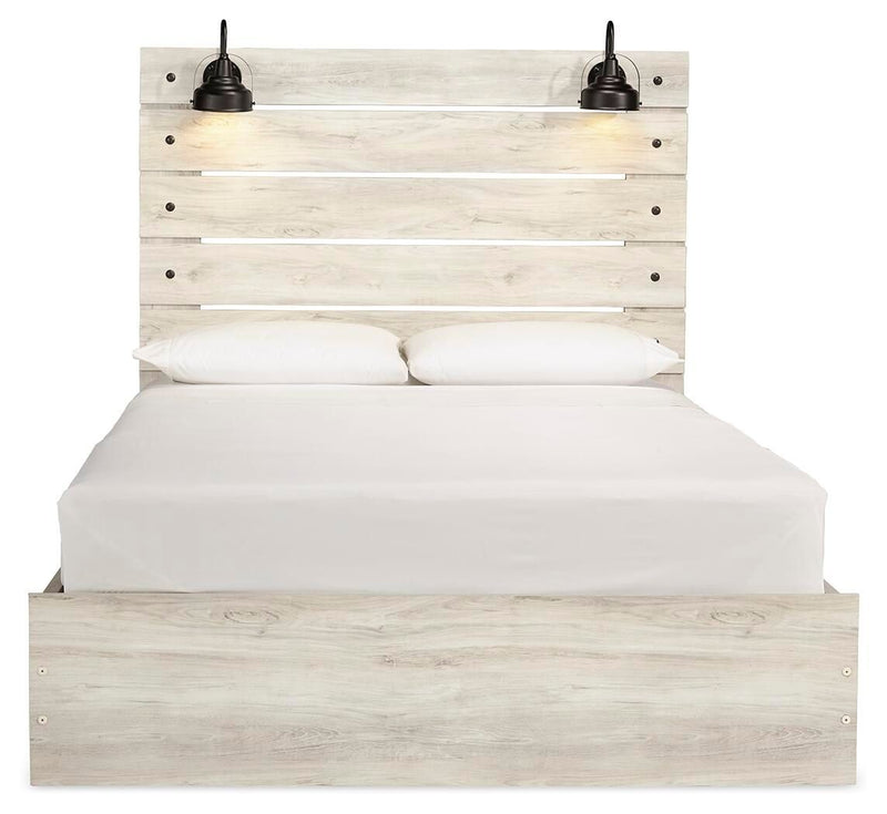 Cambeck panel bed with panel headboard, light wood base, and neatly fitted white mattress