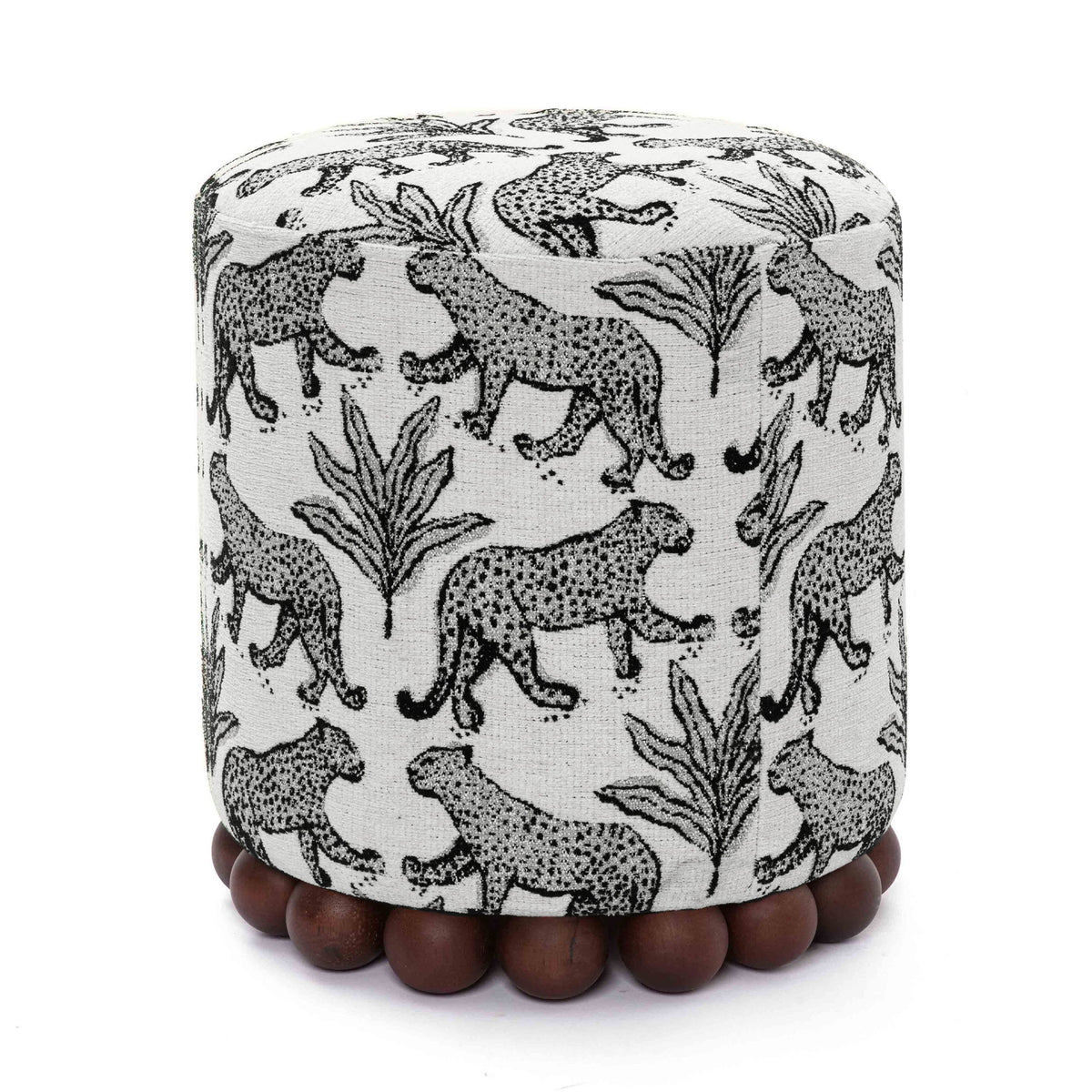 Gray animal-print ottoman with dark wood ball base; rounded cylinder silhouette.