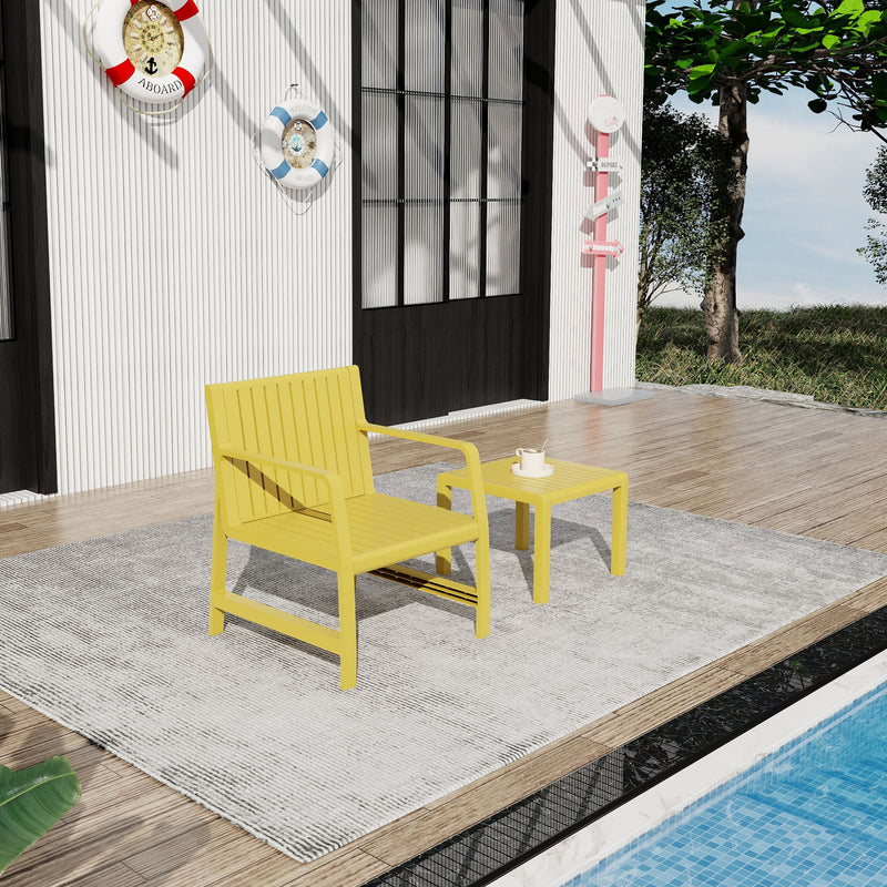 Yellow outdoor chair with matching side table, on gray rug
