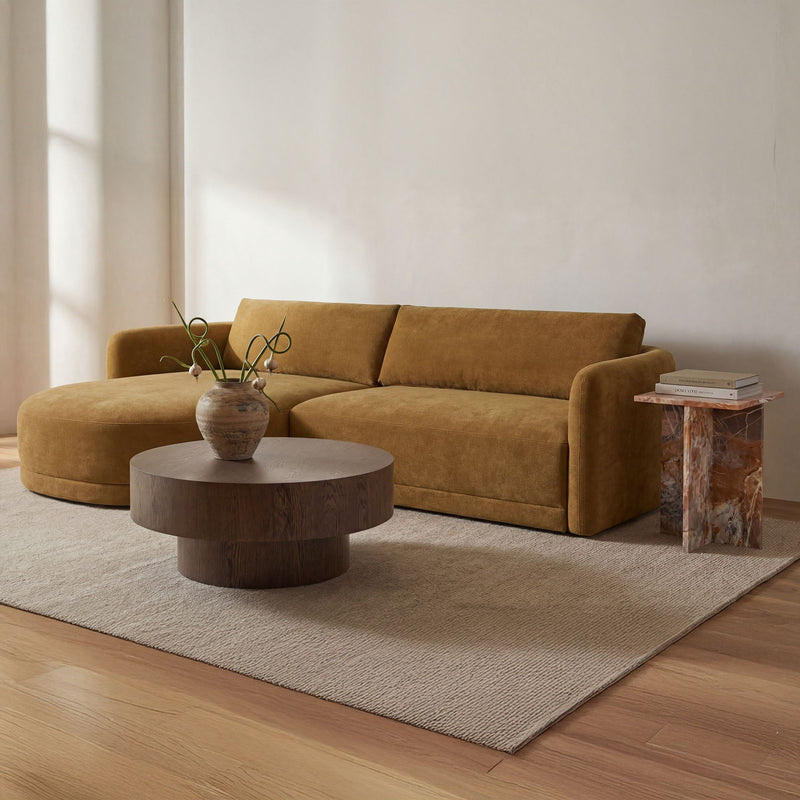 Round dark brown wood coffee table on short pedestal base