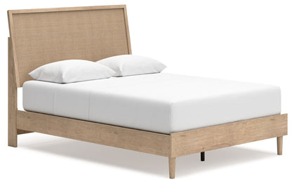 Beige panel bed with upholstered headboard and white mattress with pillows