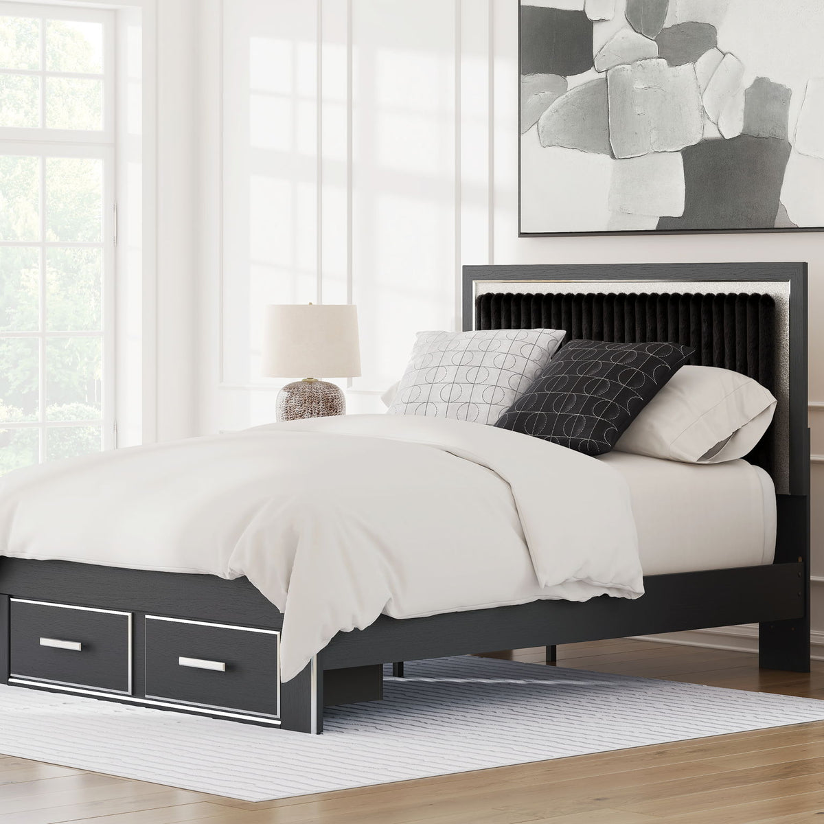 Upholstered panel storage bed in a living room, black frame with 2 drawers, white bedding