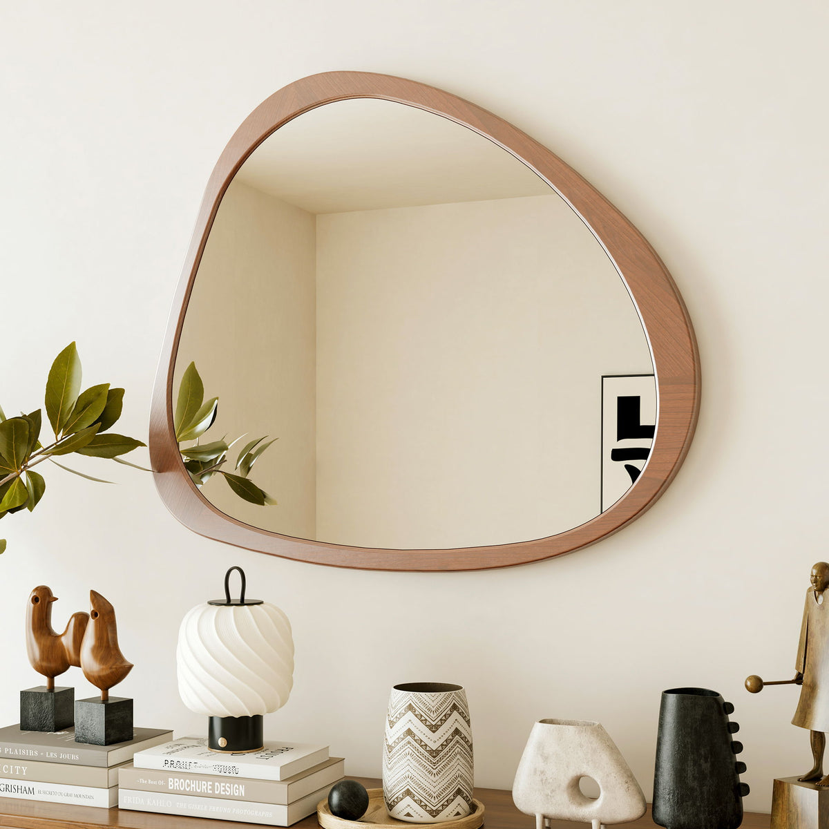 Teardrop wall mirror with natural wood border and clear reflective glass