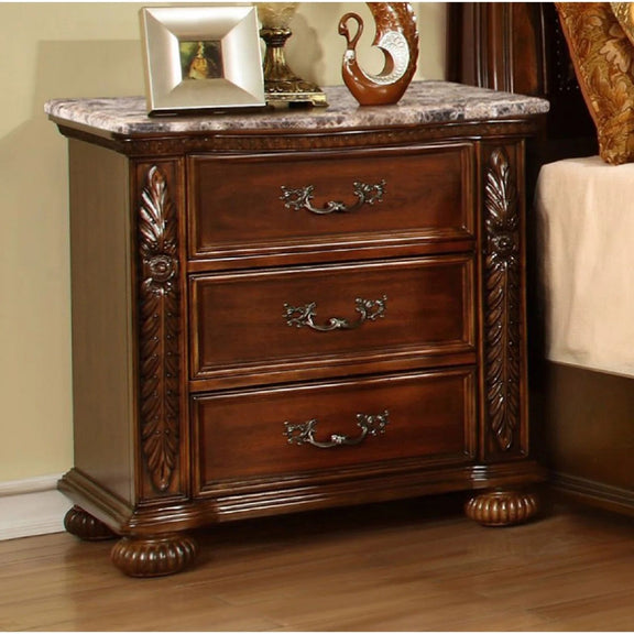 Cherry 3-drawer bedside cabinet with carved detail, brass-tone pulls, and stone-look top