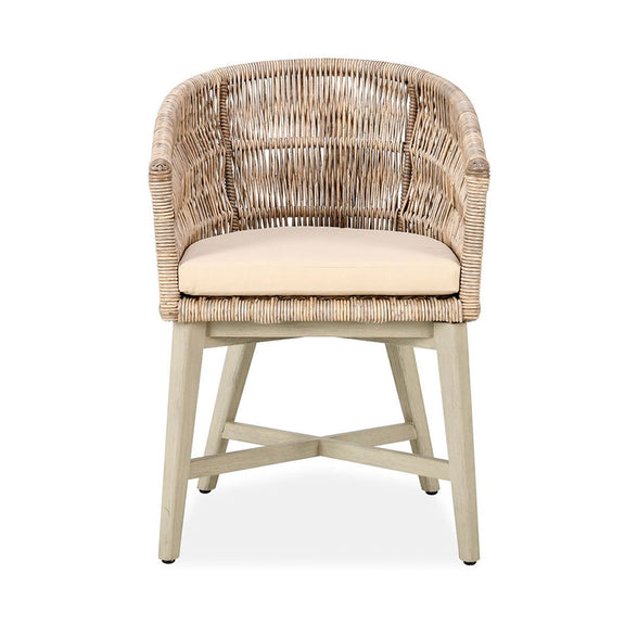 Outdoor dining chair with arched wicker back, beige cushion, and light wood legs