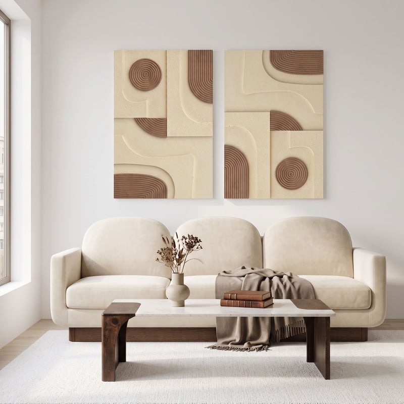 2-piece wall art above beige sofa, cream panels with light brown circular and arc relief