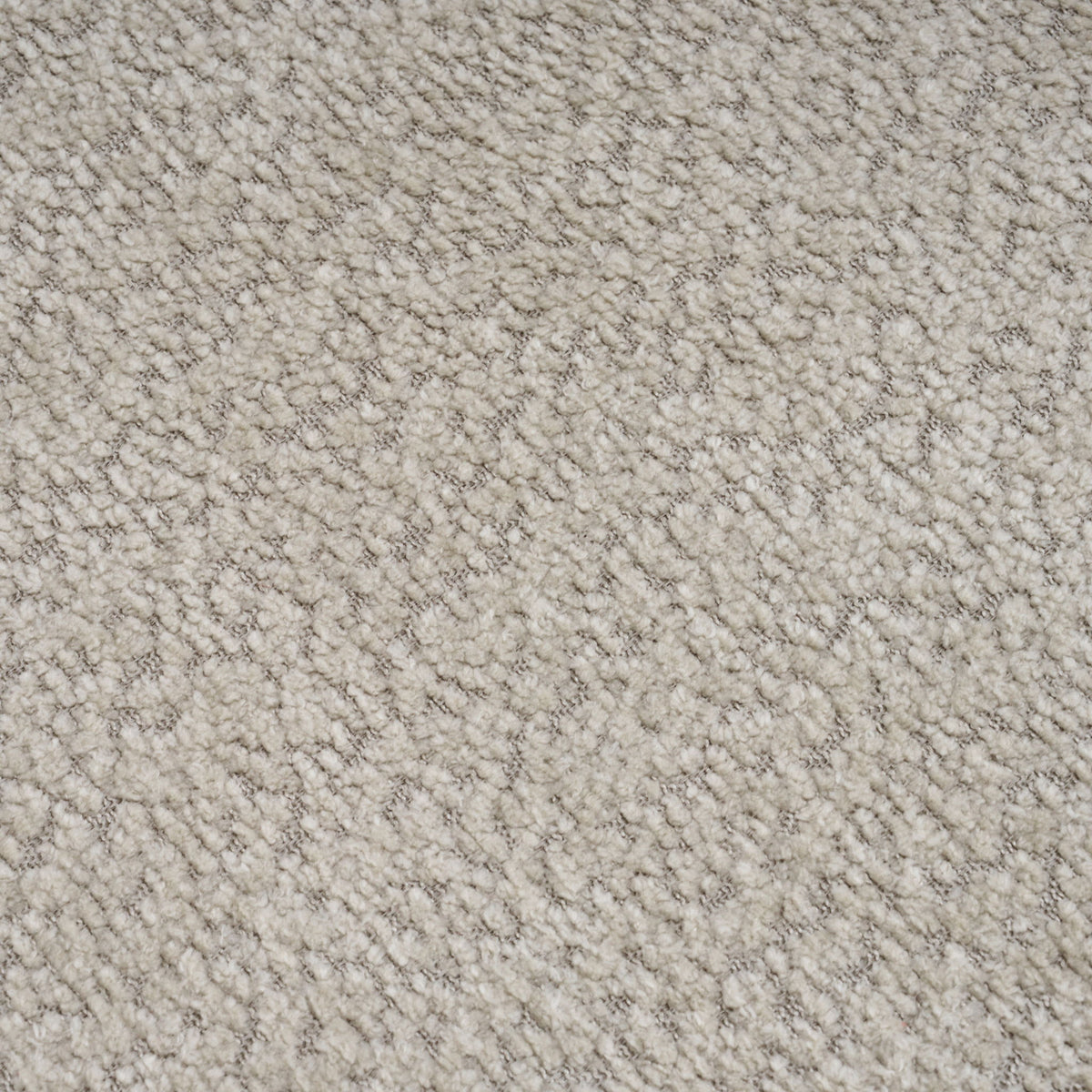 Beige loveseat upholstery fabric close-up, dense textured weave
