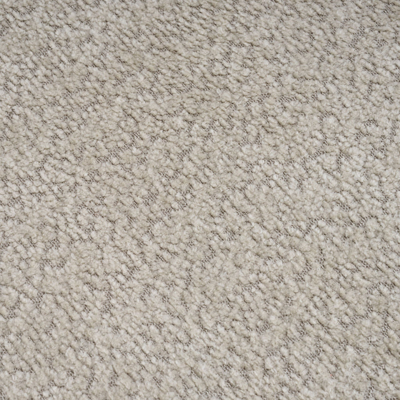 Beige loveseat upholstery fabric close-up, dense textured weave