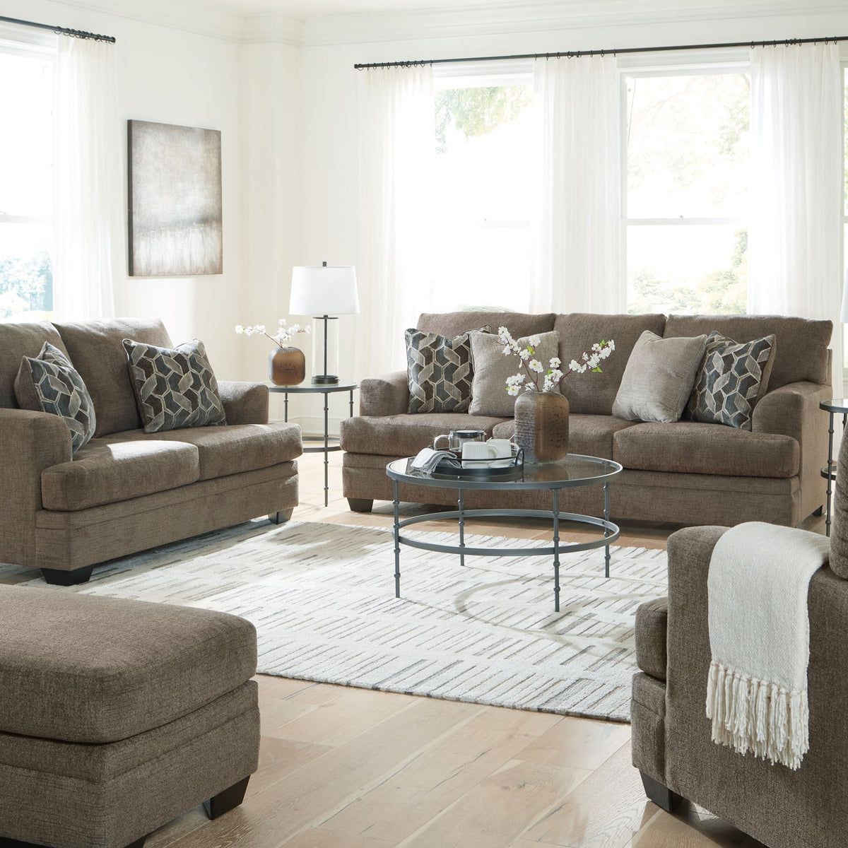 Living room sectional sofa set with chaise-style seating and patterned throw pillows
