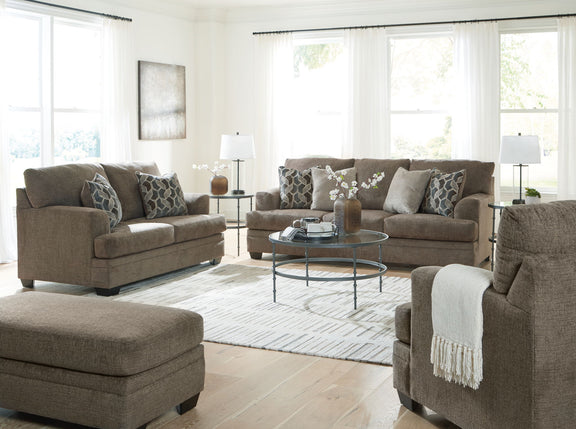 Living room sectional sofa set with chaise-style seating and patterned throw pillows