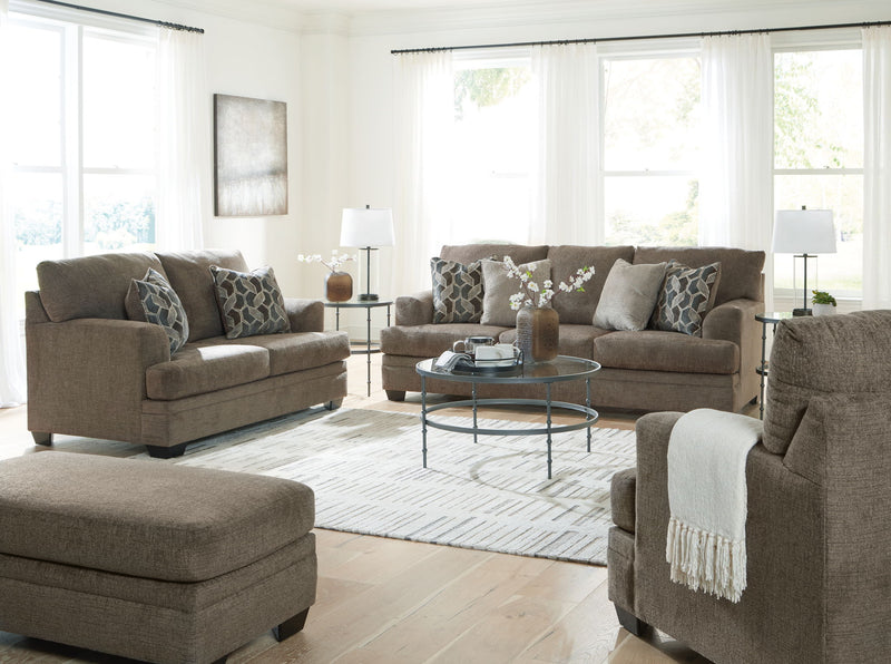 Living room sectional sofa set with chaise-style seating and patterned throw pillows
