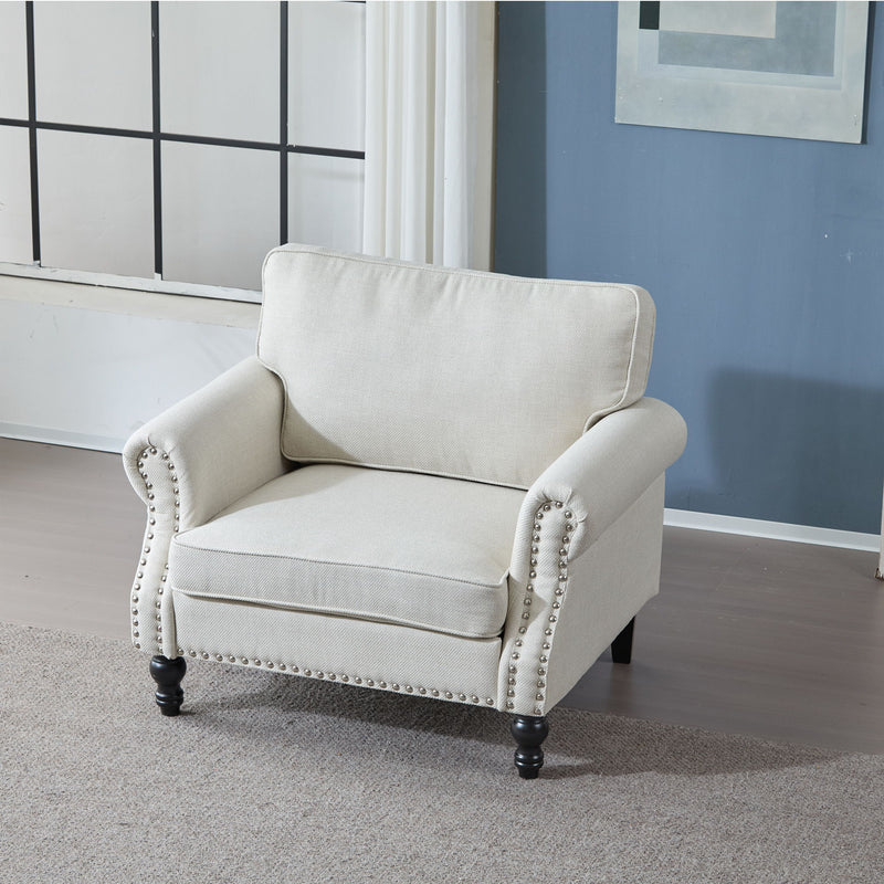 Beige rolled arm single sofa with nailhead trim, cushioned seat, and turned legs