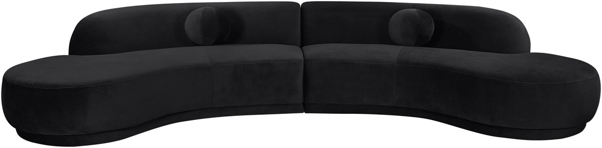 Black velvet sectional sofa with curved arms and deep seat cushions