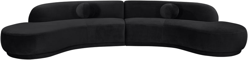 Black velvet sectional sofa with curved arms and deep seat cushions