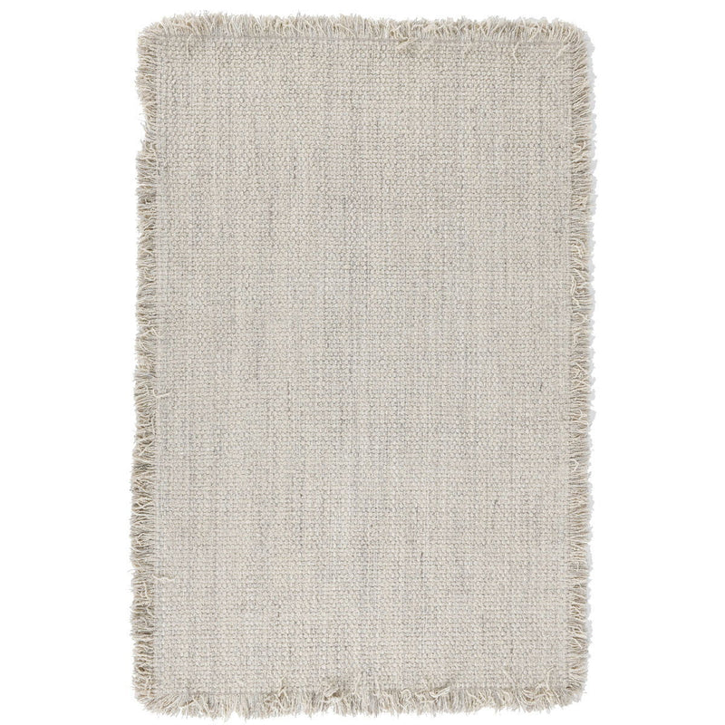 Ivory wool rug with short fringe, rectangular flatwoven texture.