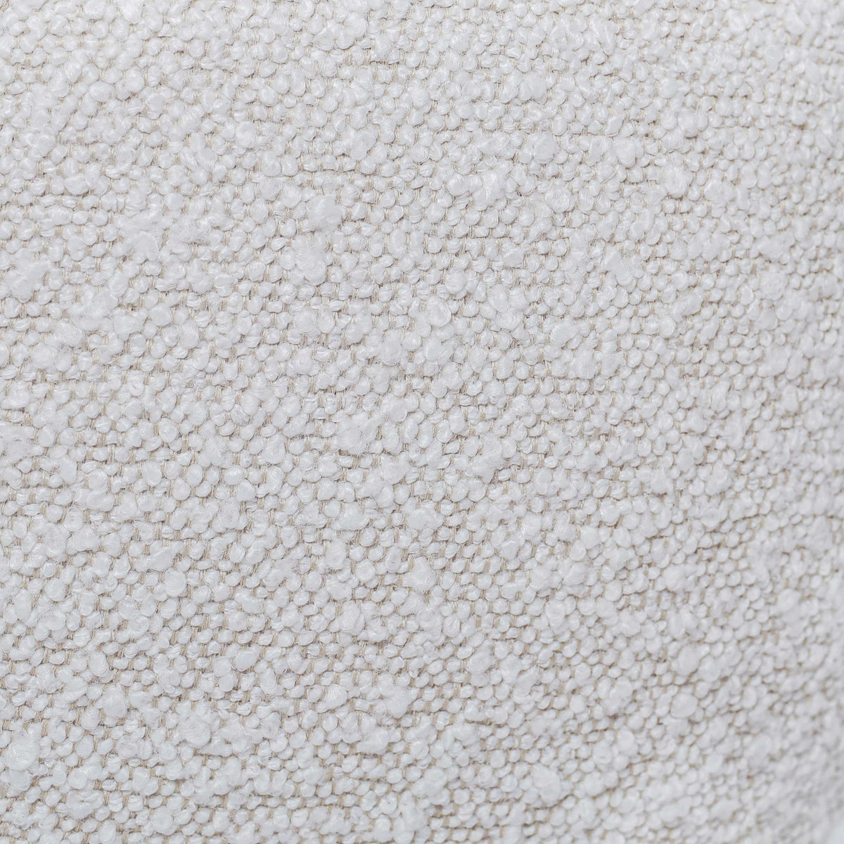 Close-up of white boucle-style fabric texture on a Boba pillow