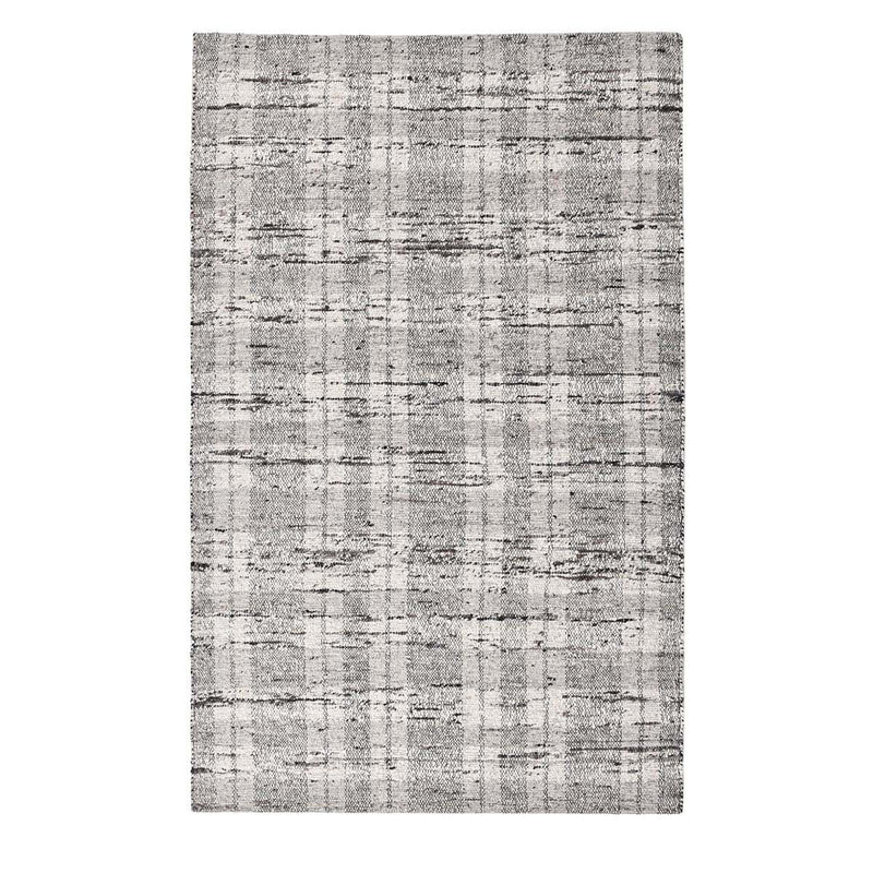 Light gray textured rug with dense speckling and grid-like pattern detail