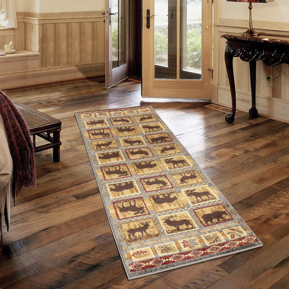 Lodge area rug runner-style with animal blocks and geometric border in tan and rust