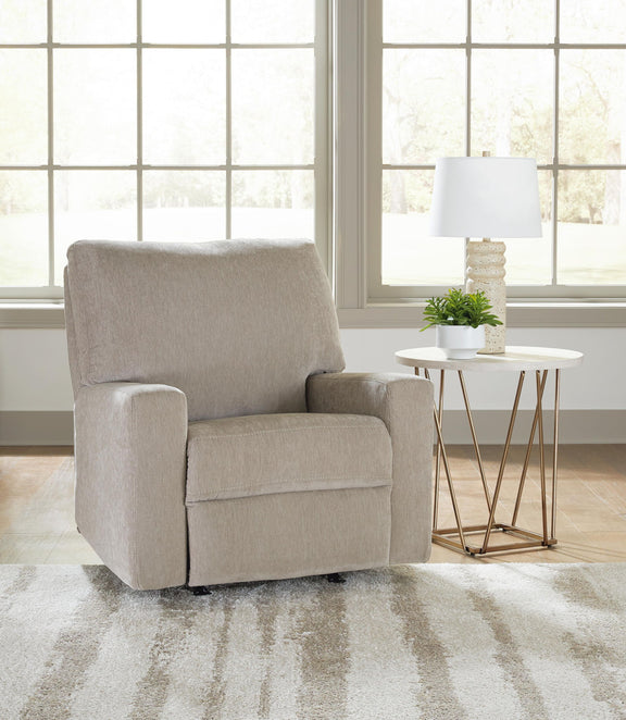 Gray fabric rocker recliner with padded arms, cushioned seat, and tall backrest.
