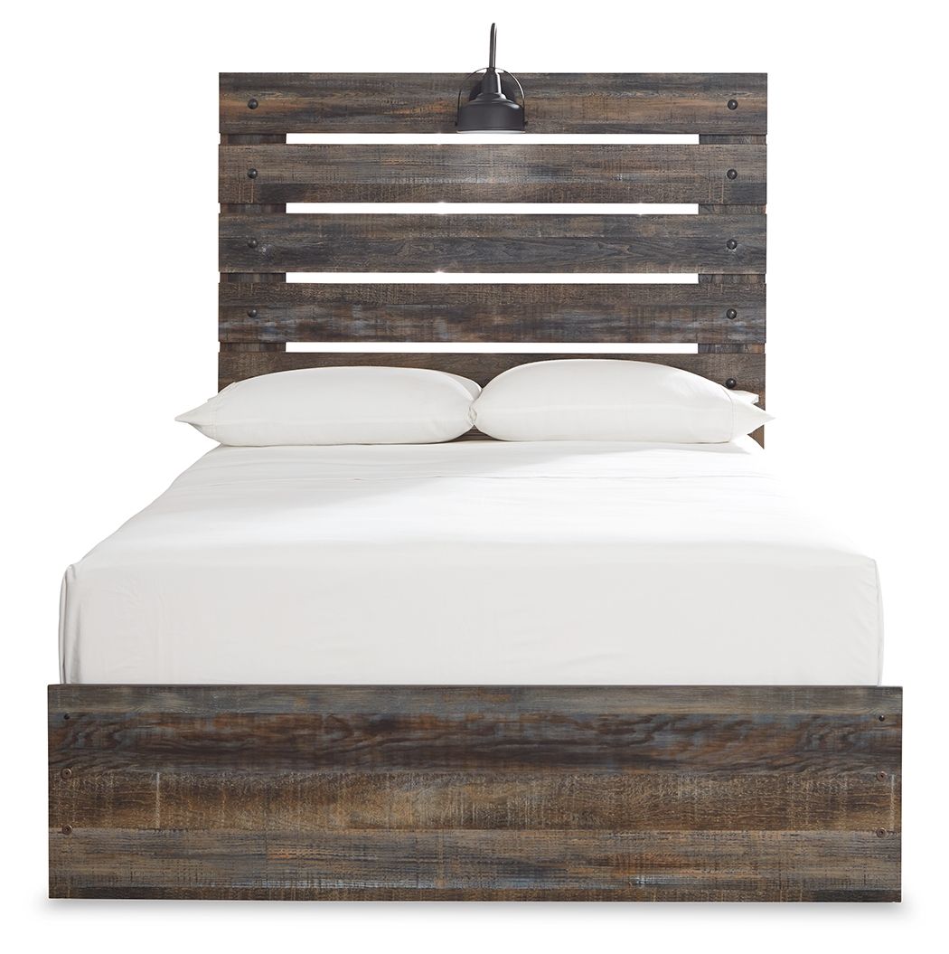 Panel bed with dark distressed wood headboard slats and a low platform base