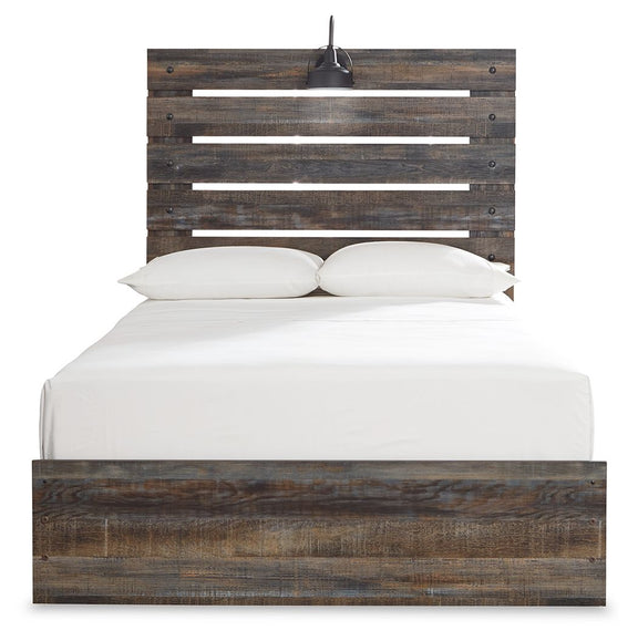 Panel bed with dark distressed wood headboard slats and a low platform base