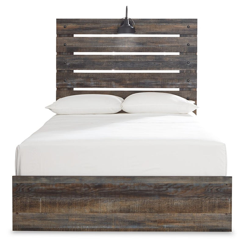 Panel bed with dark distressed wood headboard slats and a low platform base