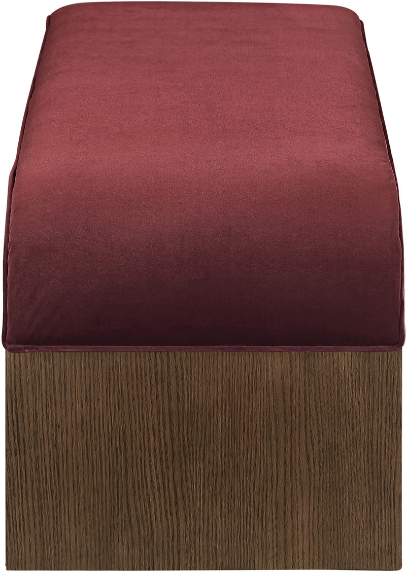 Velvet seat cushion in burgundy on a dark wood bench base