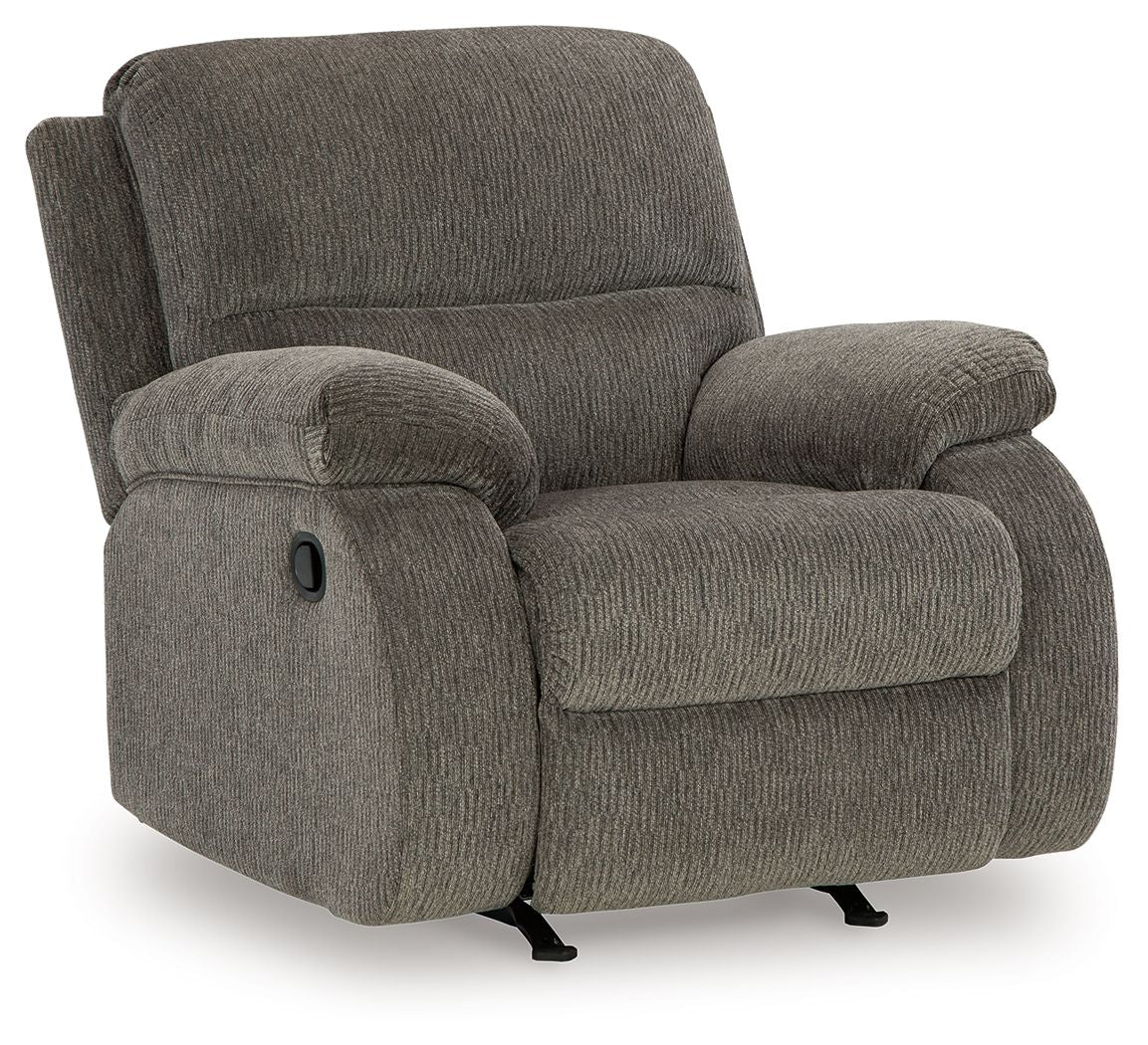 Brindle rocker recliner chair with padded arms, wide seat, and recline footrest