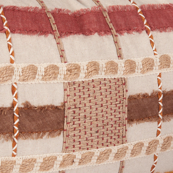 Stratton ML pillow close-up patchwork with woven blocks and tan fringe trim
