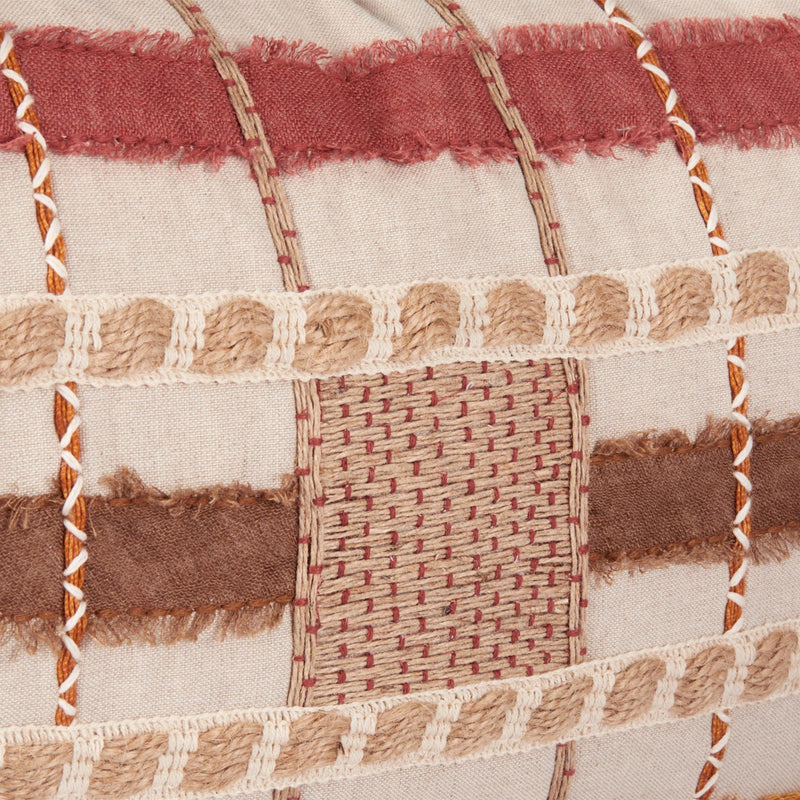 Stratton ML pillow close-up patchwork with woven blocks and tan fringe trim