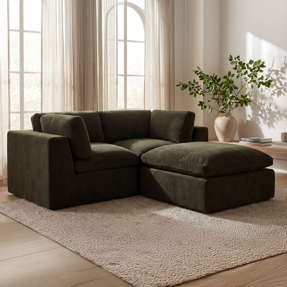 Dark green modular sectional sofa with chaise seat, wide back cushions and boxy arms