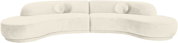 Light cream velvet sectional sofa with rounded arms and deep seat cushions