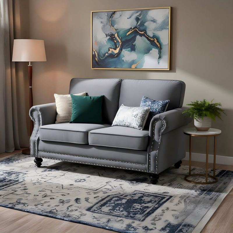 Gray 2-seat loveseat sofa with nailhead trim and turned legs, upholstered seat cushions