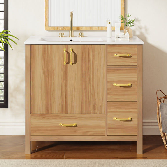 Bathroom vanity with acacia wood finish, gold handles, white countertop and three drawers