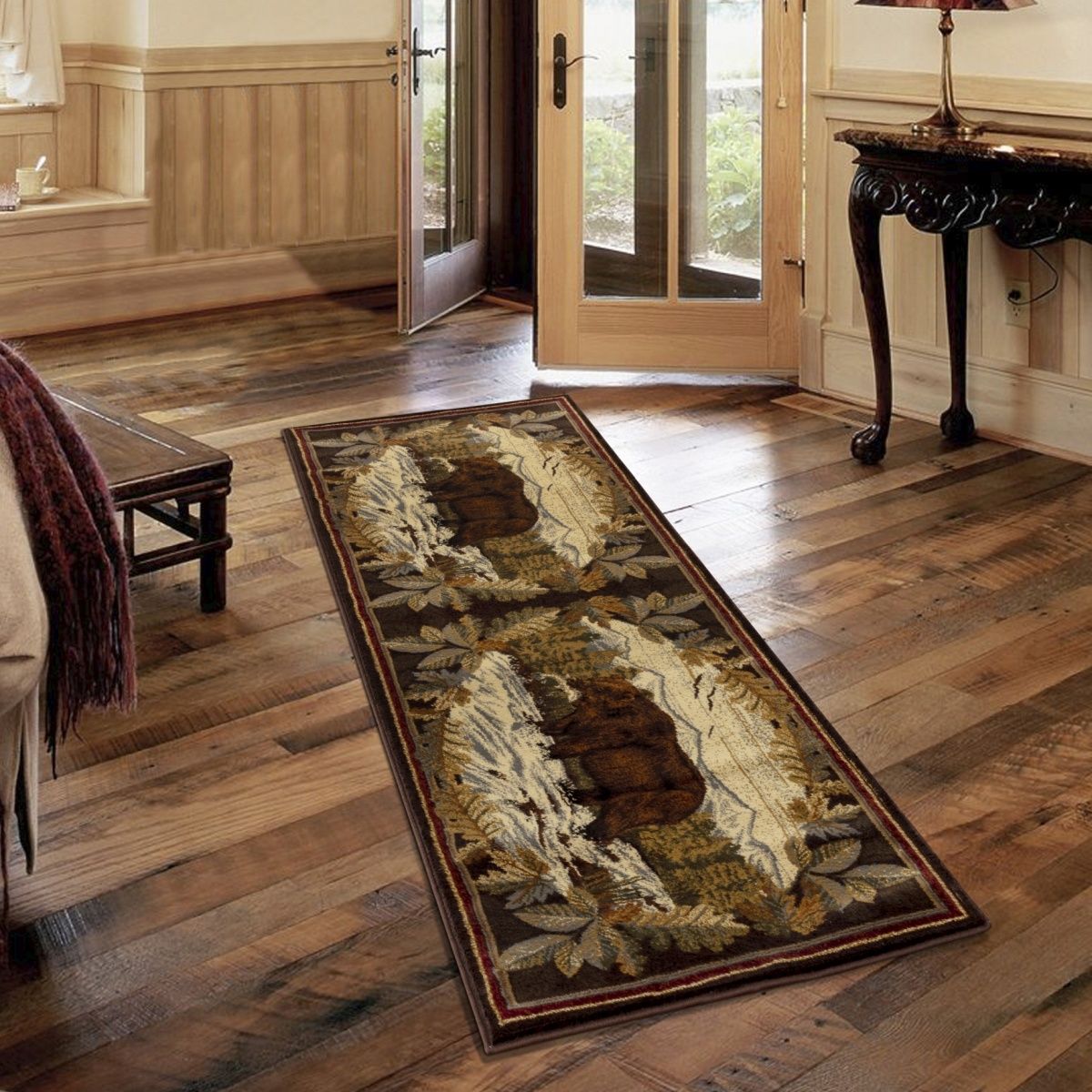 Lodge area rug with bear silhouette and botanical motif, cream field with dark brown frame