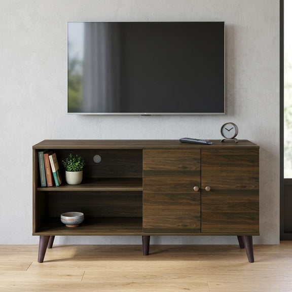 Brown TV stand with open shelf, drawer, and two-door cabinet with round pulls.