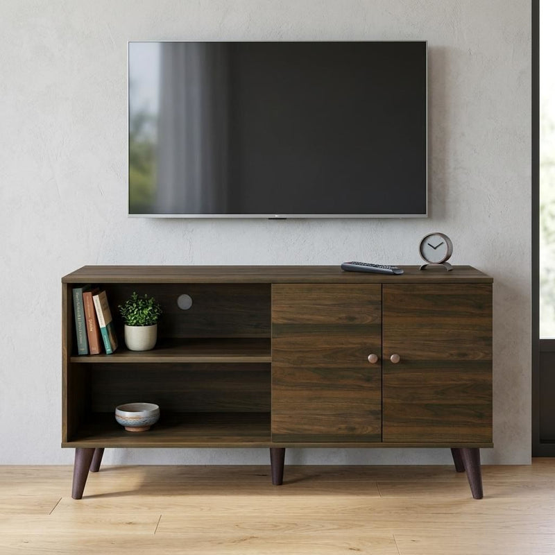 Brown TV stand with open shelf, drawer, and two-door cabinet with round pulls.