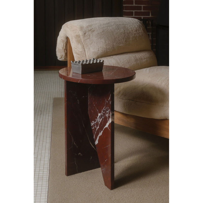 Faux fur accent chair with plush cushion and dark wooden frame, corner view
