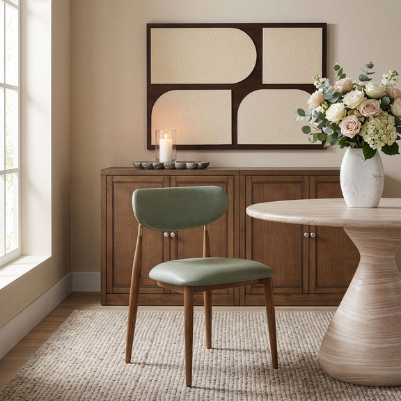 Green upholstered dining side chair with curved back and walnut legs