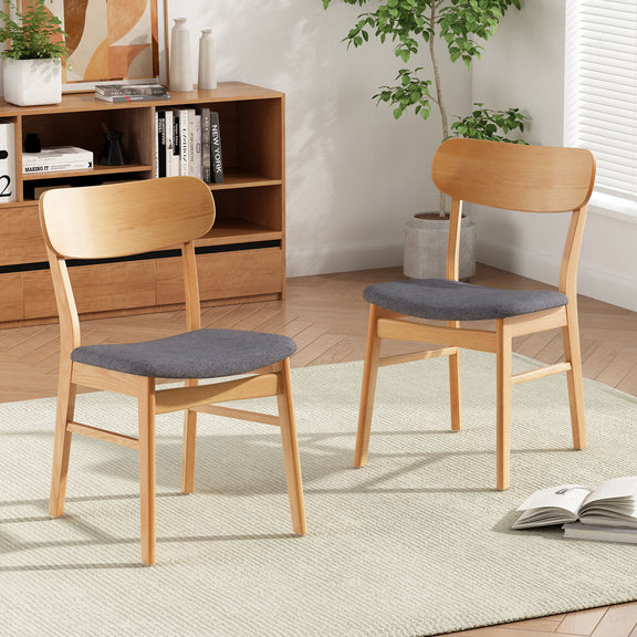 Light wood dining chair with dark gray cushioned seat and curved backrest