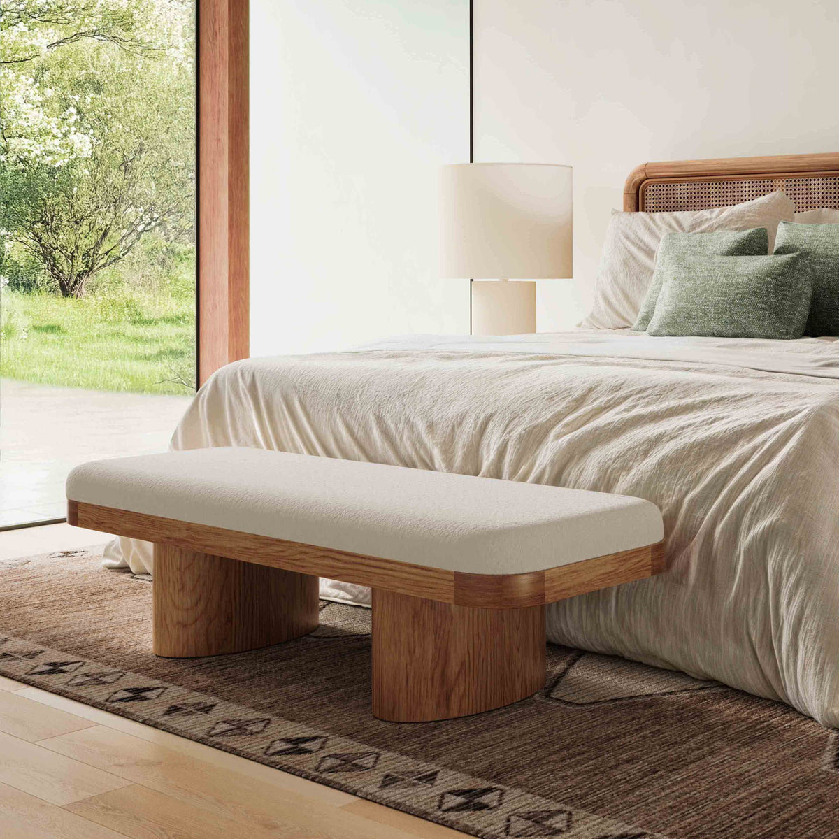 Upholstered bench with light cream seat cushion and warm wood frame