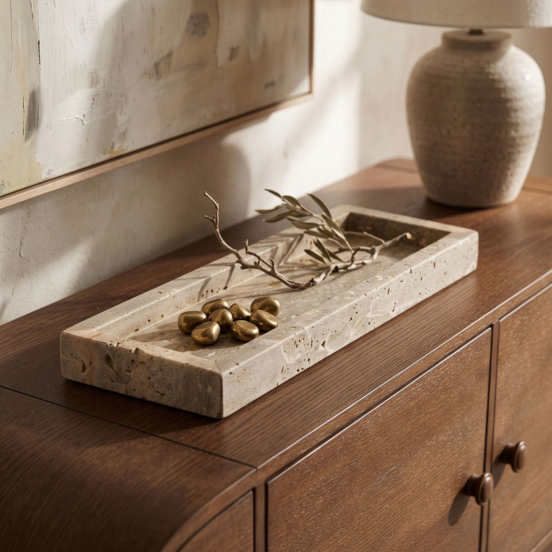 Beige stone marble tray with raised edges and mottled veining