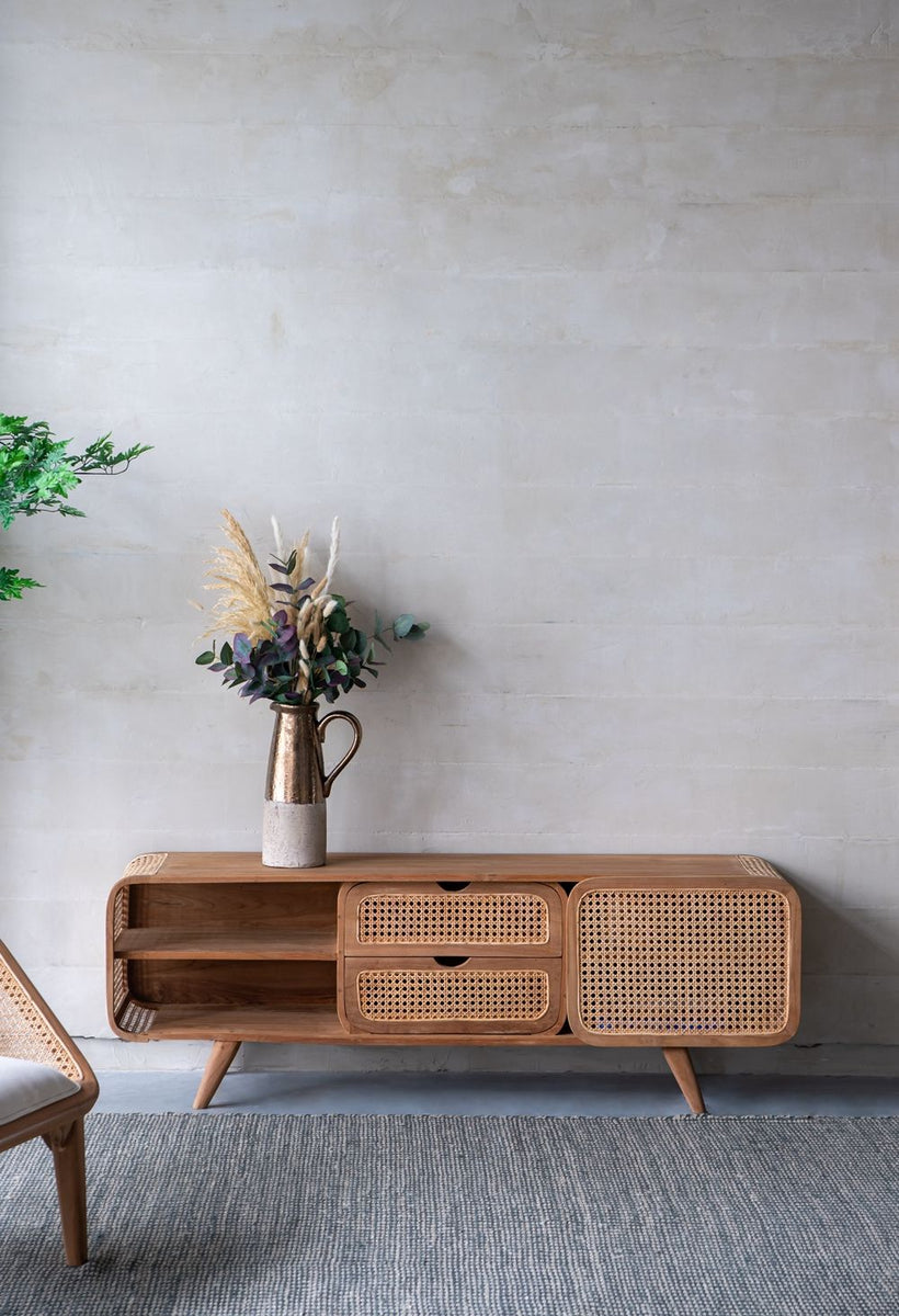 Natural teak cabinet with cane-front drawers, open shelving, and a right-side cabinet door