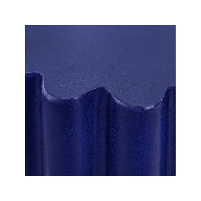 Close-up of blue ribbed accent table edge and scalloped rim