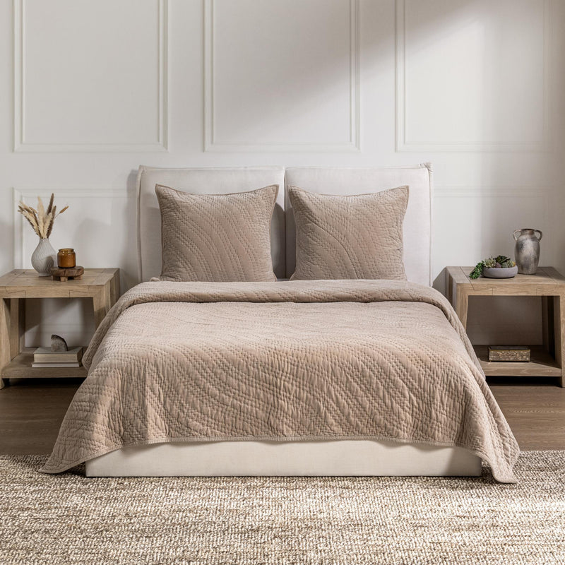 Light beige velvet bedding set with two pillows and quilted bedspread