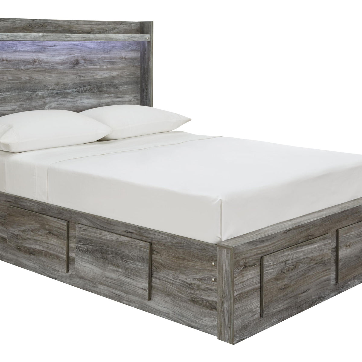 Gray panel bed with slatted headboard and drawer-front panels, styled with white linens