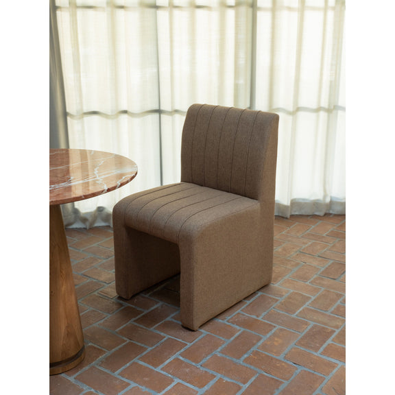 Light brown dining chair with tall channel back and padded armrests, square base