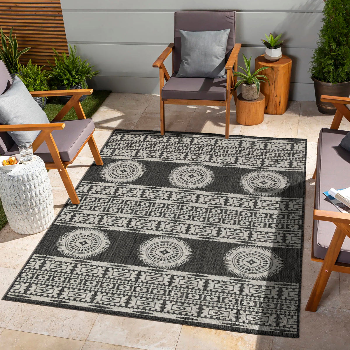 Navy and white geometric polypropylene area rug with circular medallion rows