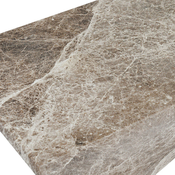 Concrete accent table surface close-up, speckled brown and ivory textured finish
