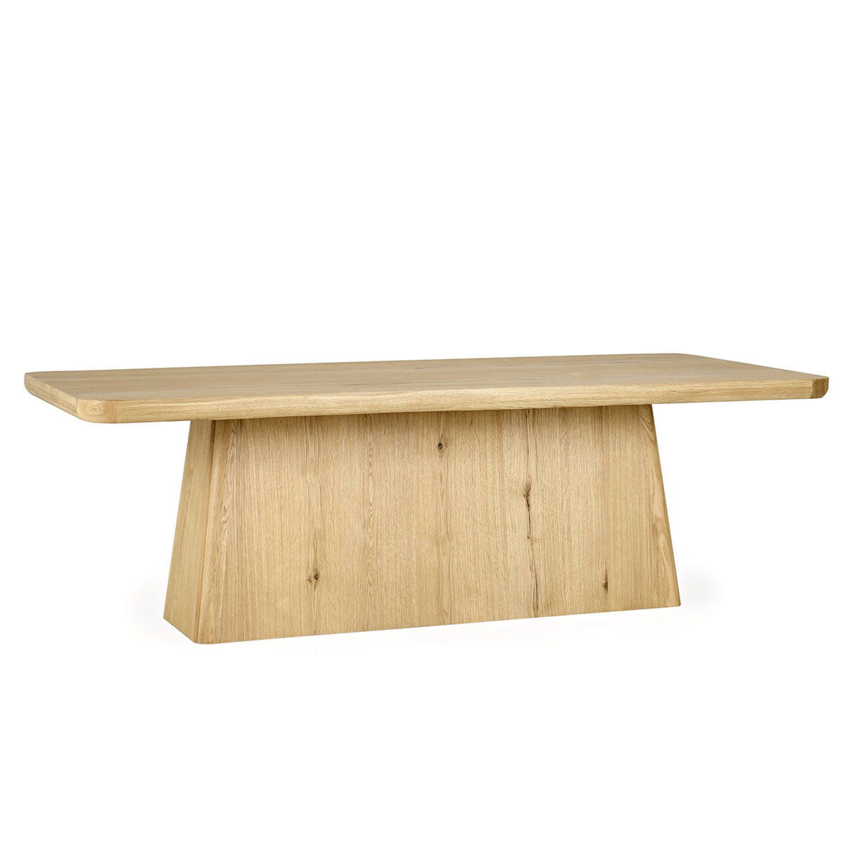 Light brown wood dining table with rectangular top and wide pedestal base